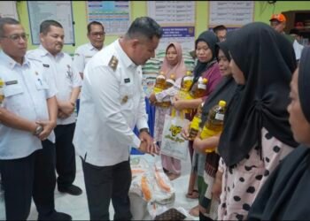 Wakil Bupati Asahan dan Bulog Salurkan Bantuan Pangan CPP Oktober–November 2025 di Desa Tinggi Raja